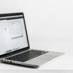 a laptop on a table with a blank screen